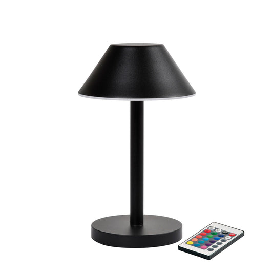 Die LED-Lampe Zelda Midi von Duni GmbH in modernem Graphit-Design mit rundem Sockel und konischem Schirm steht neben einer Fernbedienung mit bunten Tasten - die ideale, energieeffiziente Beleuchtungslösung.