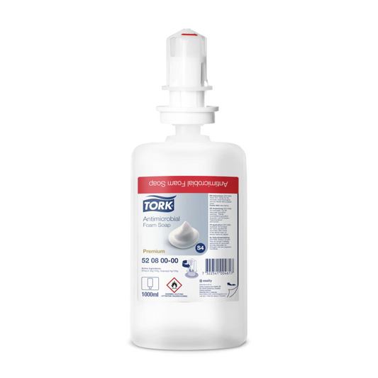 Eine 1000 ml Tork 520800 Schaumseife zur Händedekontamination Premium S4 Flasche von TORK - Essity Professional Hygiene Germany GmbH, mit weißem Spenderkopf und rotem Etikett. EN 1499 zertifiziert, ideal für effektive Händedekontamination.
