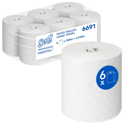 Απεικονίζεται ένα κουτί με έξι ρολά Scott® Essential™ πετσέτες χεριών - Ρολό / Λευκό (6 ρολά) της Kimberly-Clark GmbH, με ένα ρολό στο μπροστινό μέρος και μια συσκευασία με πληροφορίες για το εμπορικό σήμα και το προϊόν για την υγιεινή καθαριότητα των χεριών.