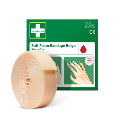 Eine beigefarbene Cederroth-Weichschaumstoffbinde (3x450cm, 1 Stück) von Orkla Wound Care AB steht vor ihrer grün-weißen Schachtel mit einer illustrierten Gebrauchsanweisung.