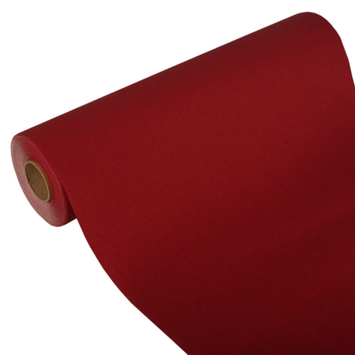 Ένας μερικώς ξετυλιγμένος διάδρομος τραπεζιού της PAPSTAR GmbH, Tissue «ROYAL Collection» (24 μ x 40 εκ), δείχνει σε λευκό φόντο τον χαρτονένιο πυρήνα του και έτσι επιδεικνύει το υψηλής ποιότητας υλικό tissue και τον κομψό σχεδιασμό του.