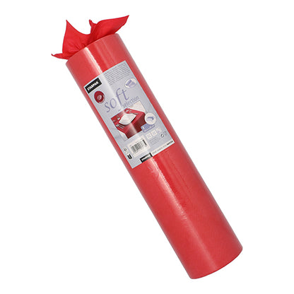 Ένας ρολό Starpak δρομέας τραπεζιού, υφασμάτινο βελόνα «soft selection» (24 m x 40 cm), στέκεται όρθιος. Στην ετικέτα εμφανίζονται πληροφορίες προϊόντος και τυλιγμένα δώρα, ενώ ο μαλακός δρομέας είναι μερικώς ξετυλιγμένος στην κορυφή.