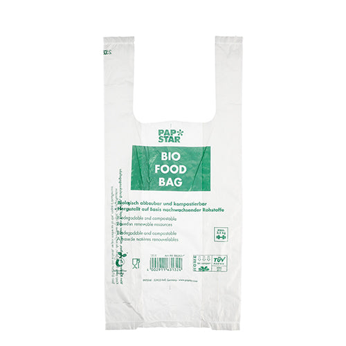 Ein transparenter Biofolienbeutel mit der Aufschrift „BIO FOOD BAG“ mit grünem Text von der PAPSTAR GmbH. Diese umweltfreundliche Hemdchen-Tragetasche ist biologisch abbaubar, kompostierbar und kommt als 100 Knotenbeutel-Rolle.
