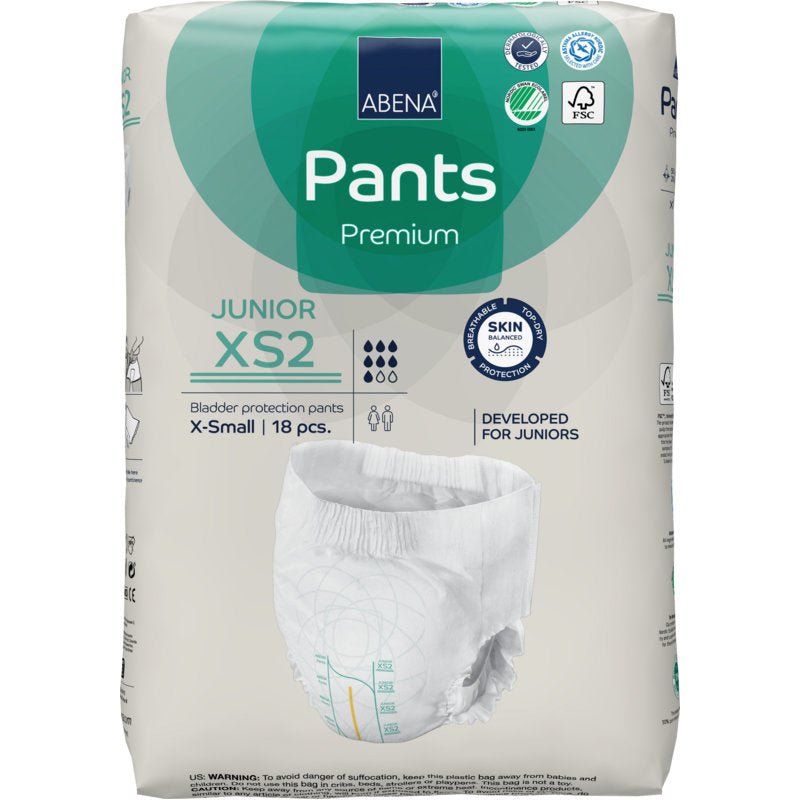 Ένα πακέτο ABENA Pants Junior Premium, Μέγεθος XS2 (18 κομμάτια) από την Abena Re-Seller GmbH προσφέρει προστασία από την ακράτεια για τους νέους. Η συσκευασία δείχνει χαρακτηριστικά προϊόντος, λογότυπα πιστοποίησης και μια εικόνα της πάνας.