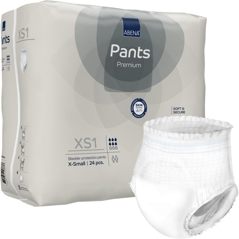 Απεικονίζεται μια συσκευασία με 24 ABENA Pants XS1, Premium από την Abena Re-Seller GmbH (μέγεθος X-Small, πάνες pull-up για ενήλικες), όπου μια λευκή πάνα είναι εκτός συσκευασίας με πληροφορίες προϊόντος και σύμβολα.
