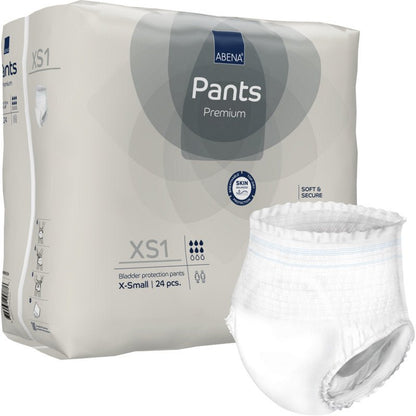 Απεικονίζεται μια συσκευασία με 24 ABENA Pants XS1, Premium από την Abena Re-Seller GmbH (μέγεθος X-Small, πάνες pull-up για ενήλικες), όπου μια λευκή πάνα είναι εκτός συσκευασίας με πληροφορίες προϊόντος και σύμβολα.