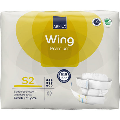 Eine Packung ABENA Wing Premium von Abena Re-Seller GmbH enthält 15 kleine Inkontinenzprodukte mit Gürtel für Schutz und Komfort. Auf der überwiegend weiß-gelben Verpackung sind Produktinformationen und ein Windelbild abgebildet.