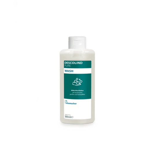 Ένα λευκό πλαστικό μπουκάλι με το προϊόν Dr. Schumacher Descolind Pure Wash (500 ml) της εταιρείας Dr. Schumacher GmbH, με πράσινη και λευκή ετικέτα, βρίσκεται μπροστά από ένα απλό ανοιχτό γκρι φόντο. Αυτό το καθαριστικό με ουδέτερο pH για το δέρμα και χωρίς άρωμα είναι ιδανικό για ευαίσθητο δέρμα.