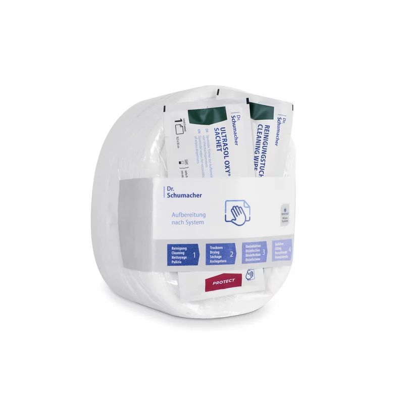 Μία συσκευασία Dr. Schumacher GmbH Eco Wipes υφασμάτινων μαντηλιών για απολύμανση επιφανειών, με μαντηλάκια συσκευασμένα ξεχωριστά σε ένα διάφανο, στρογγυλεμένο πλαστικό δοχείο, επισημασμένο με πληροφορίες προϊόντος και οδηγίες χρήσης.