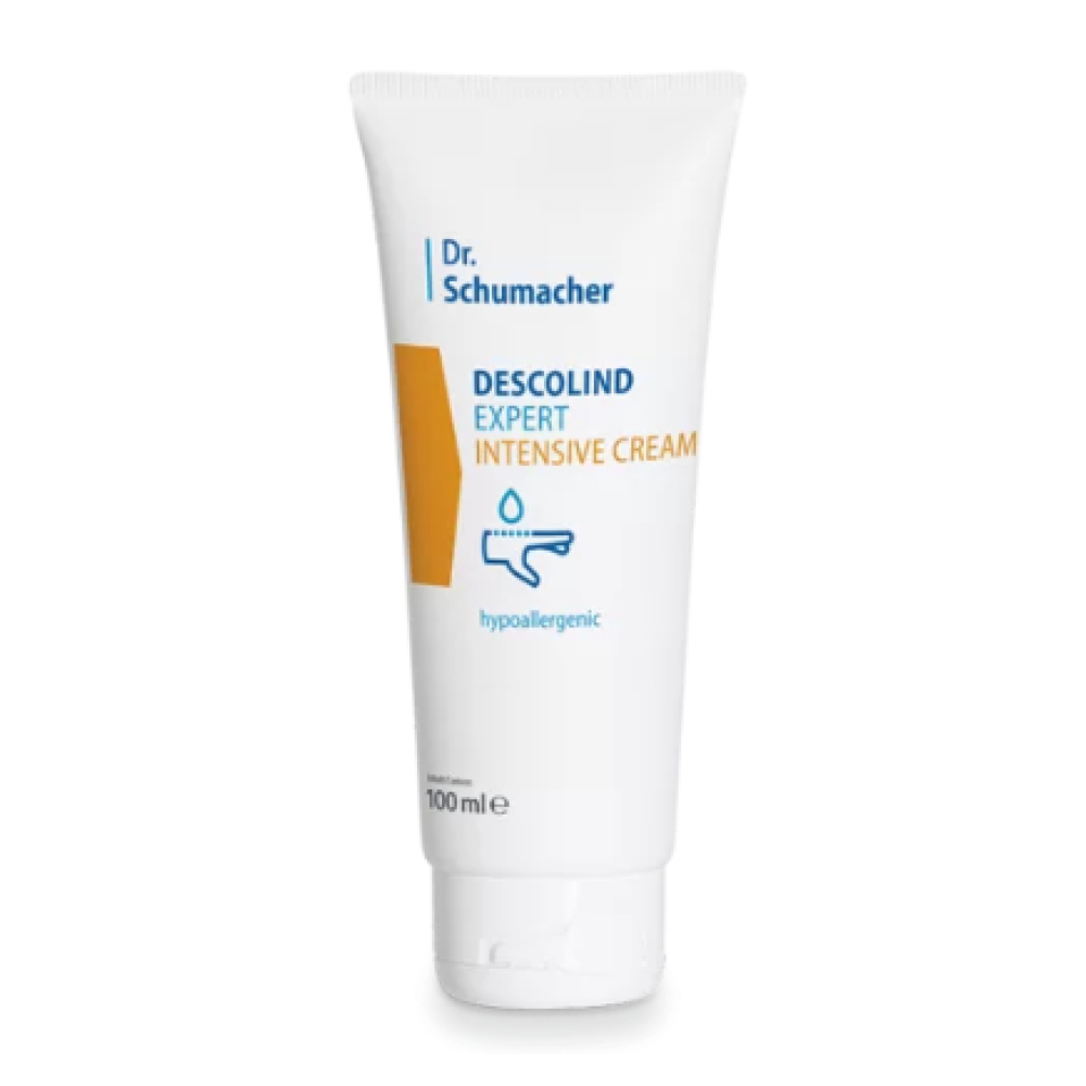 Ένας λευκός σωλήνας με την επιγραφή «Dr. Schumacher Descolind Expert Intensivcreme | Tube (100 ml)» της Dr. Schumacher GmbH στέκεται όρθιος μπροστά από ένα απλό φόντο. Η συσκευασία διαθέτει ένα κίτρινο ορθογώνιο και ένα σύμβολο σταγόνας και τονίζει τις υποαλλεργικές ιδιότητες, καθιστώντας την ιδανική για ευαίσθητο δέρμα.
