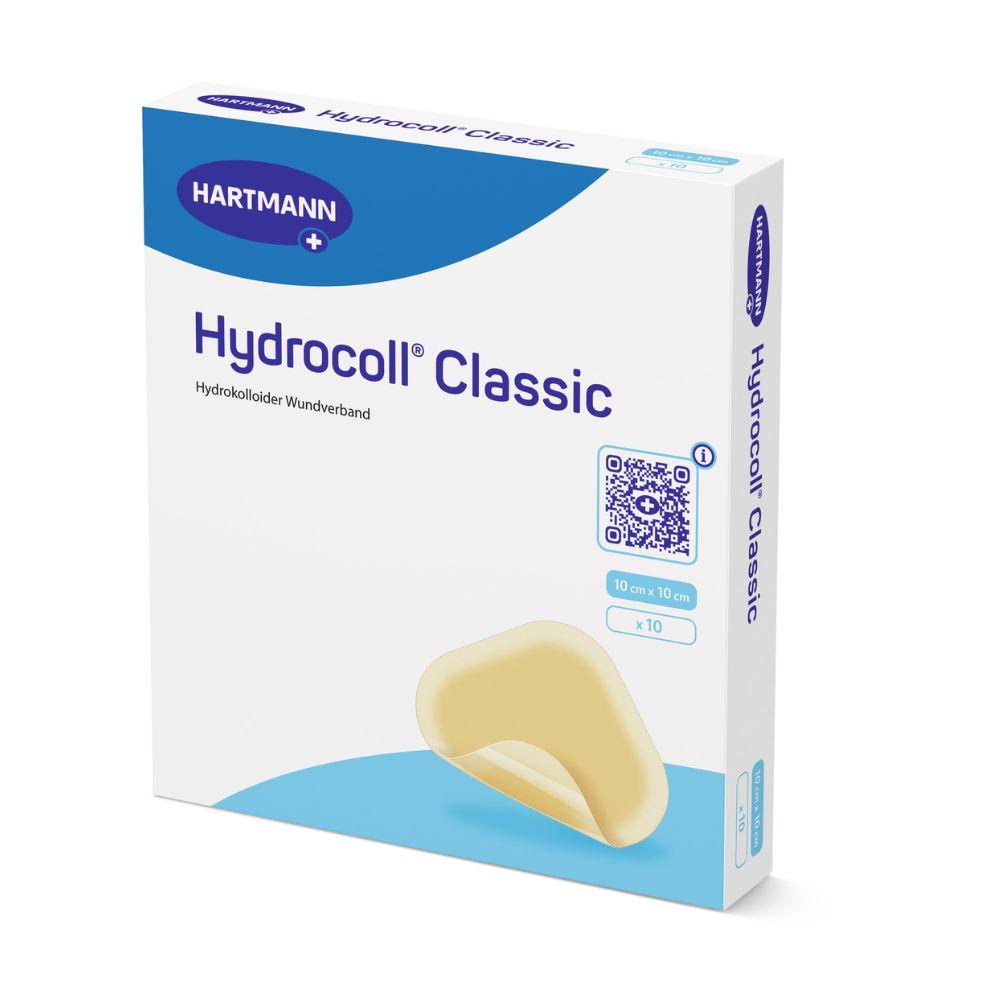 Μια συσκευασία Hartmann Hydrocoll Classic Verband steril, σφραγισμένη μεμονωμένα από την Paul Hartmann AG – ιδανική για υγρή περιποίηση τραυμάτων, υποστηρικτική κοκκιοποίηση και επιθηλιοποίηση. Περιέχει 10 αποστειρωμένους επιδέσμους μεγέθους 10 x 10 cm σε κυρίως λευκή συσκευασία με μπλε πινελιές.