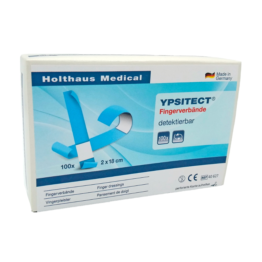 Ένα κουτί Holthaus Ypsitect® Fingerverband ανιχνεύσιμο επίδεσμο της Holthaus Medical GmbH & Co. KG. Το κυρίως μπλε-λευκό κουτί περιέχει 100 ελαστικούς επιδέσμους δακτύλων με διαστάσεις 2 x 18 εκ. Η συσκευασία είναι ιδανική για φροντίδα πληγών και περήφανα επισημαίνει ότι το προϊόν κατασκευάζεται στη Γερμανία.