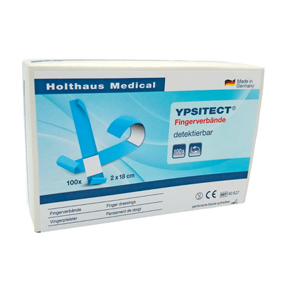 Ένα κουτί Holthaus Ypsitect® Fingerverband ανιχνεύσιμο επίδεσμο της Holthaus Medical GmbH & Co. KG. Το κυρίως μπλε-λευκό κουτί περιέχει 100 ελαστικούς επιδέσμους δακτύλων με διαστάσεις 2 x 18 εκ. Η συσκευασία είναι ιδανική για φροντίδα πληγών και περήφανα επισημαίνει ότι το προϊόν κατασκευάζεται στη Γερμανία.