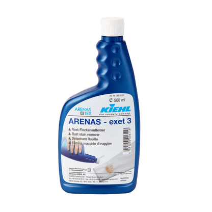 Ένα μπλε μπουκάλι 500 ml Kiehl ARENAS-exet 3 Αφαίρεση κηλίδων σκουριάς της Johannes Kiehl KG με πολυγλωσσικό κείμενο και μια εικόνα που δείχνει χέρια να αφαιρούν κηλίδες σκουριάς από ύφασμα.