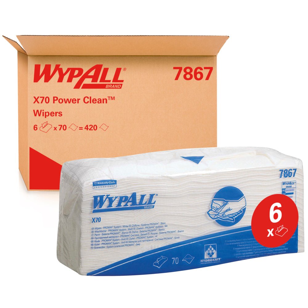 Μια συσκευασία WypAll® X70 μαντηλάκια - διπλωμένα / Λευκό (6 σακούλες x 70 μαντηλάκια) της Kimberly-Clark GmbH απεικονίζεται μπροστά από ένα κουτί με την επιγραφή "WypAll 7867". Η κόκκινη ετικέτα "6x" αναδεικνύει τα μαντηλάκια καθαρισμού βιομηχανικής ποιότητας με μπλε επωνυμία.