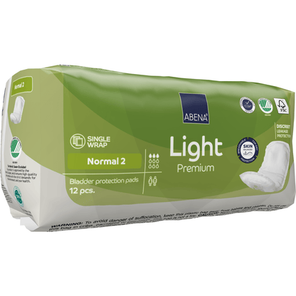Μια πράσινη συσκευασία ABENA Light Normal 2, Premium από την Abena Re-Seller GmbH περιέχει 12 σερβιέτες. Η συσκευασία περιλαμβάνει πληροφορίες για την απορροφητικότητα, τα κύρια πλεονεκτήματα του προϊόντος και σύμβολα για τη φιλικότητα προς το δέρμα και τη διακριτική προστασία.
