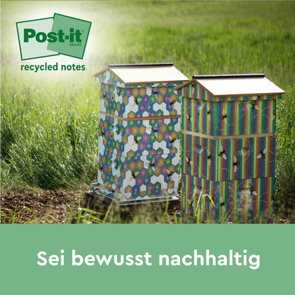 Zwei farbenfrohe Bienenstöcke stehen im Gras eines Feldes. Das 3M Post-it® Recycling Z-Notes (76 x 76 mm, 100% PEFC) Logo erscheint oben links. Am unteren Rand steht ein deutscher Text: "Sei bewusst nachhaltig.